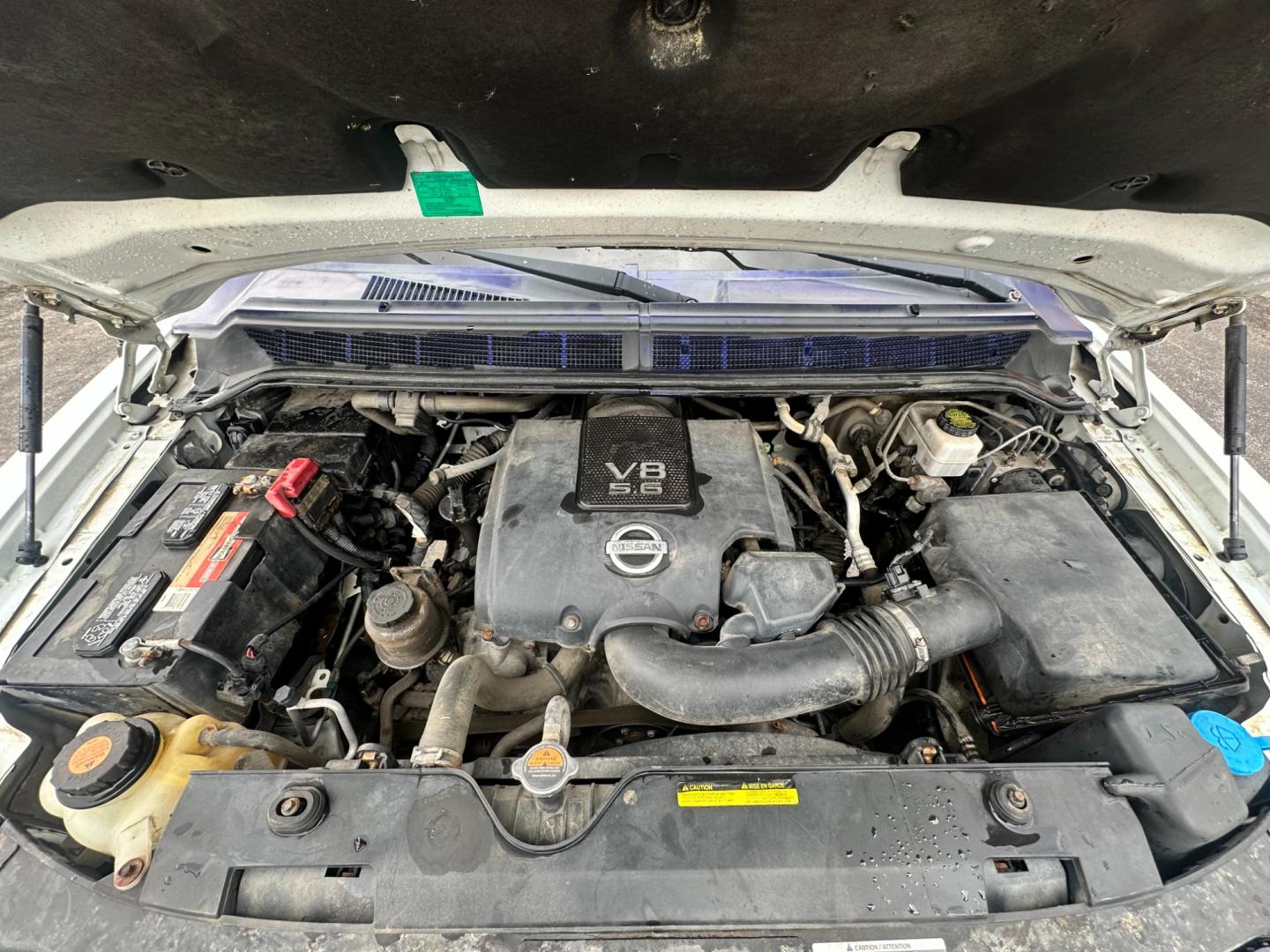 2013 White /Black Nissan Titan Pro-4X (1N6AA0EC0DN) with an 5.6L DOHC 32V V8 engine, Automatic transmission, located at 547 E. Main St., Orwell, OH, 44076, (440) 437-5893, 41.535435, -80.847855 - This 2013 Nissan Titan Pro-4X Crew Cab is a capable and well-equipped full-size pickup truck. It features a powerful 5.6L Endurance V8 engine paired with a 5-speed automatic transmission, a locking rear differential for improved traction, and a maximum towing capacity of 9,300 pounds. The truck is l - Photo#11